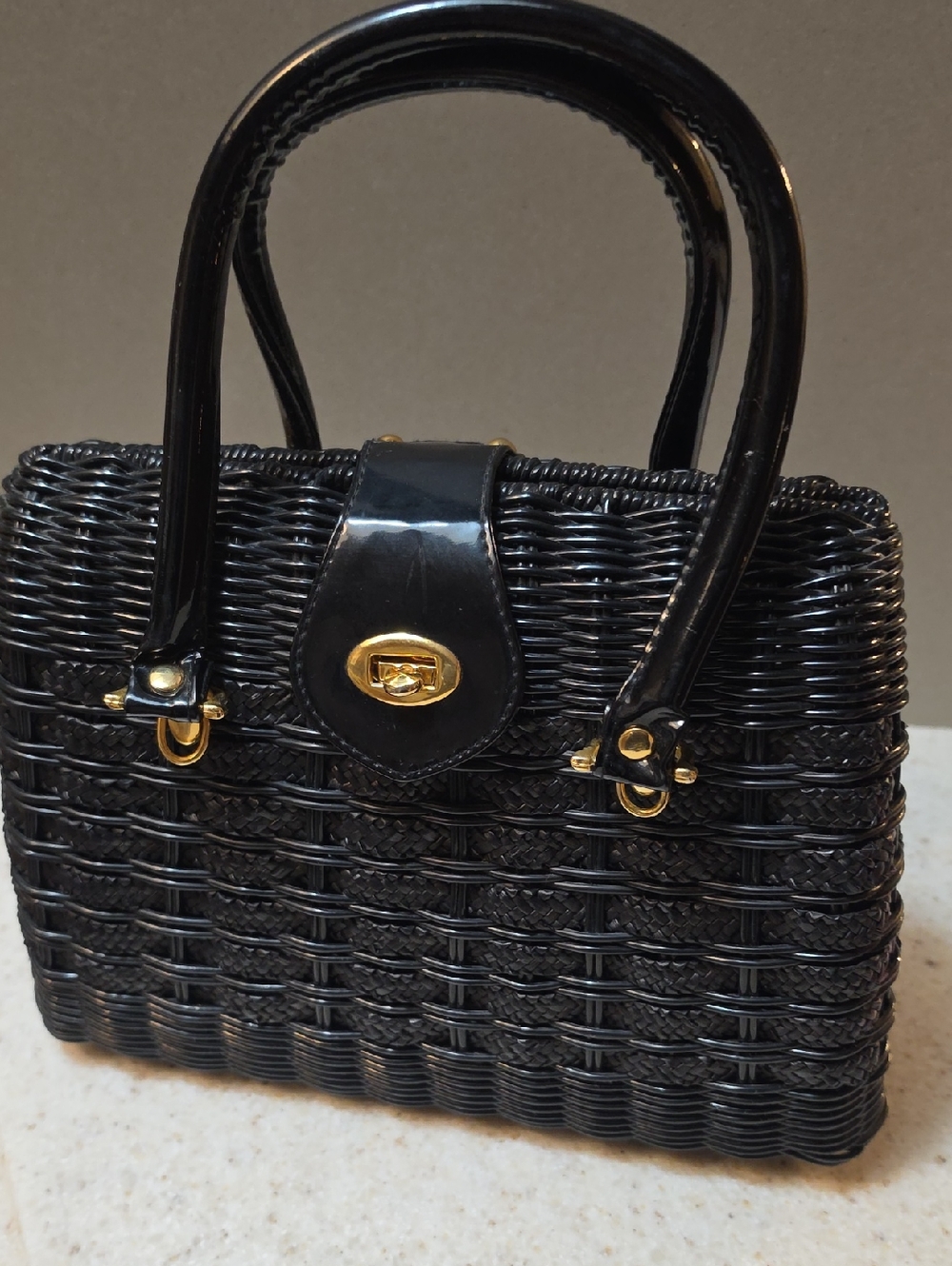 Black Woven Top-Handle Bag with Gold Hardware